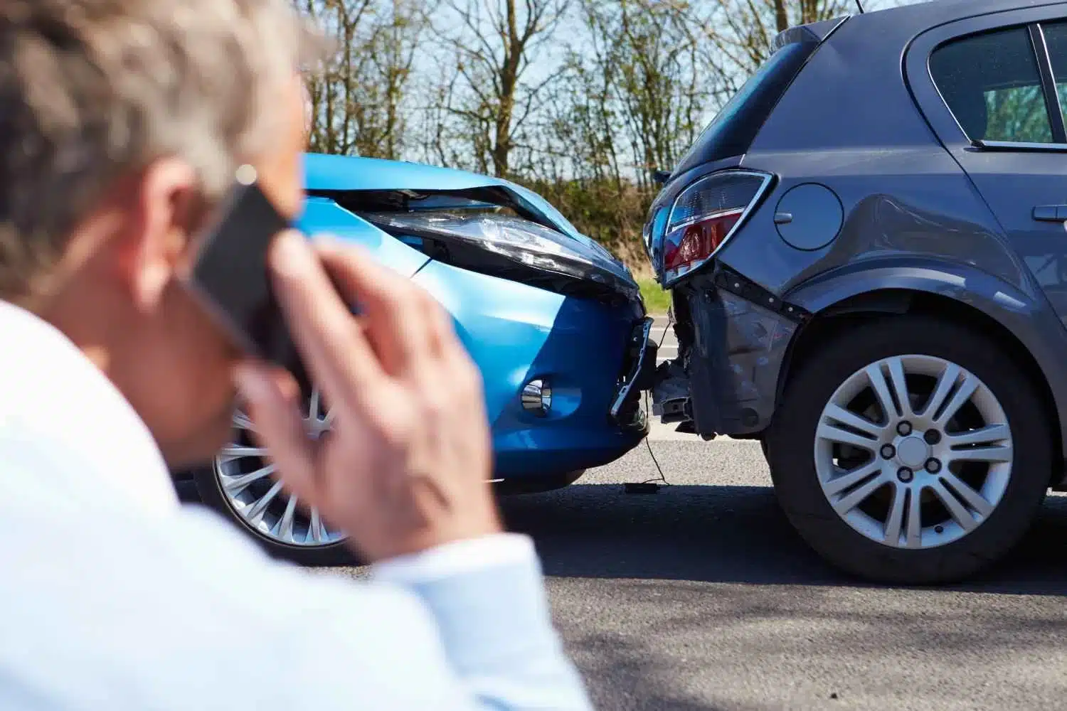 Car accident, driver calling car accident attorney about how to get accident report