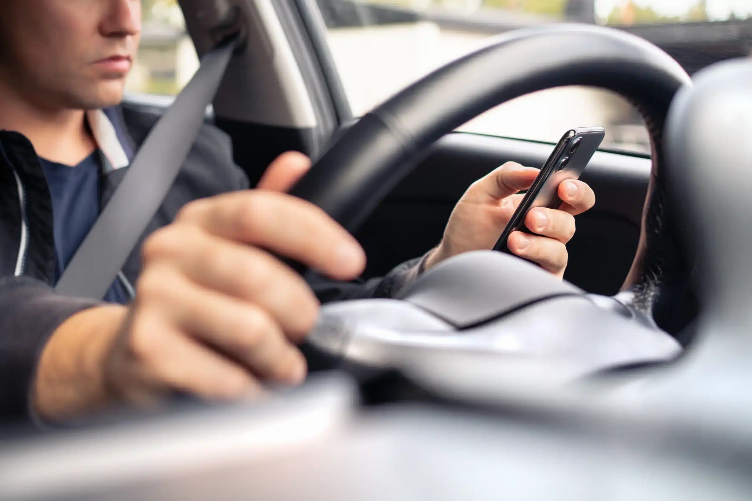 Texting,And,Driving,A,Car.,Using,Mobile,Phone,In,Traffic. car accident lawyer in Richmond